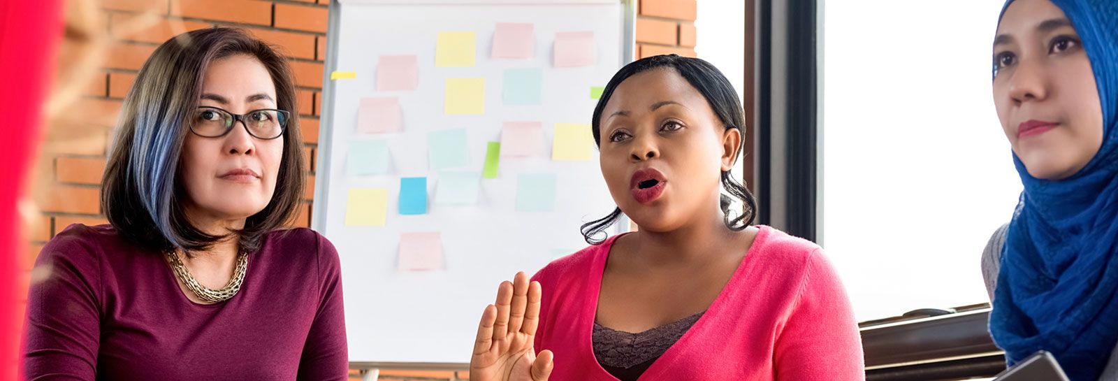 3 women in a meeting banner image