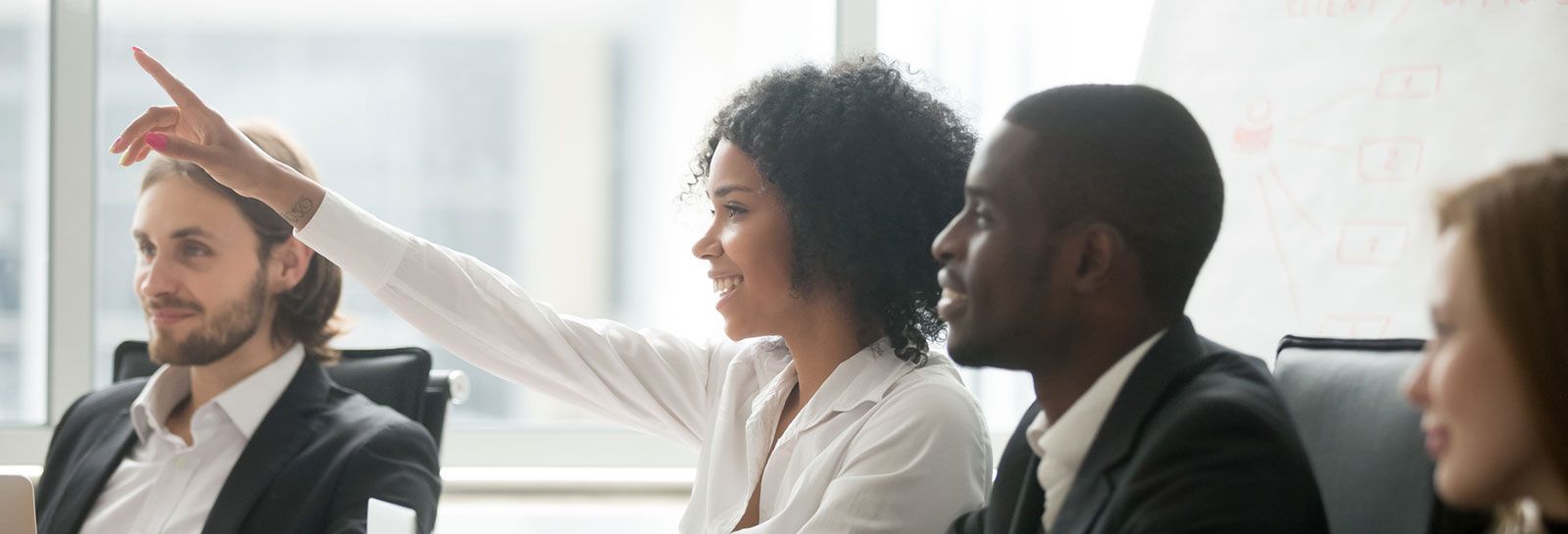 Woman raising hand in a meeting banner image